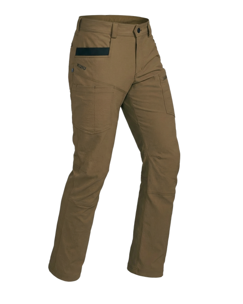 Angled pose highlighting shape and construction of Motive Workgrade Pant in Tobacco Brown